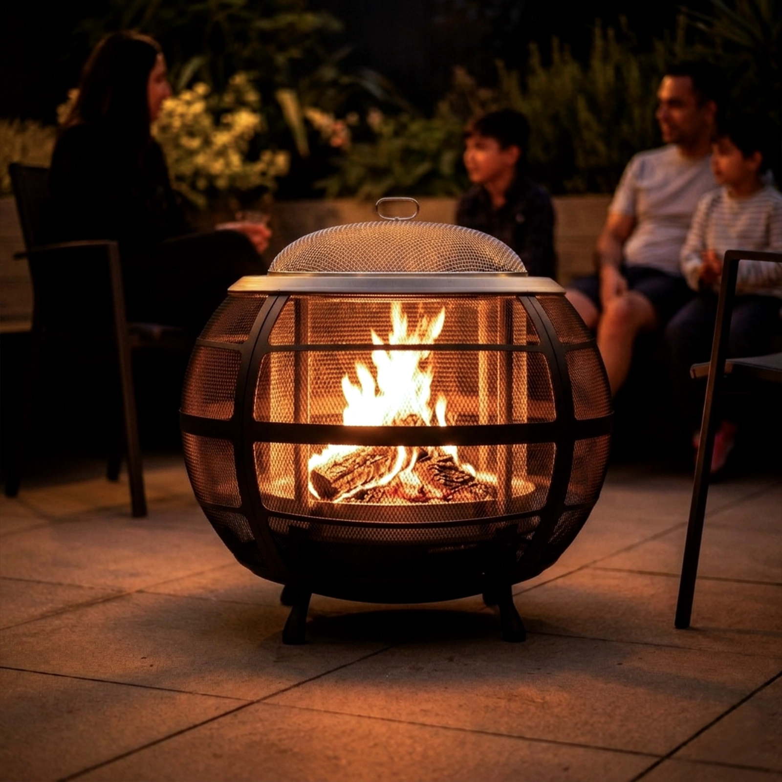 Fire pit with people sitting around at night