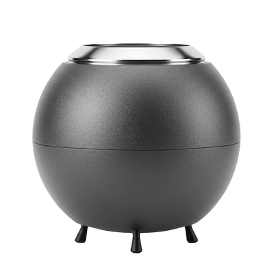 Spherical gray firepit with a metallic rim on a white background